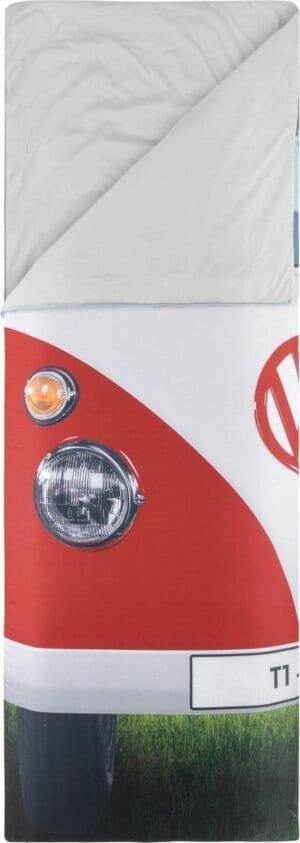 Klein busje met koplampen en gras op de ondergrond, decoratief en speels ontwerp.
