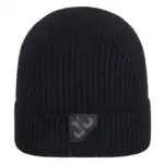 Black knitted beanie with logo patch for outdoor activities and skating.